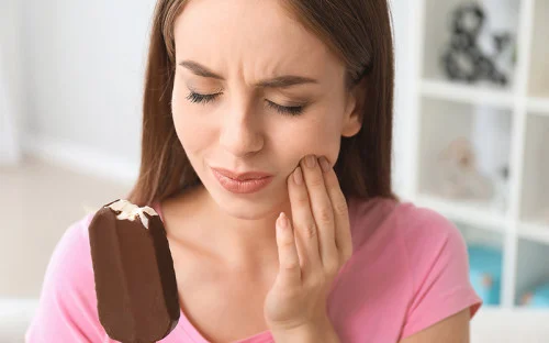 woman with tooth pain popsicle